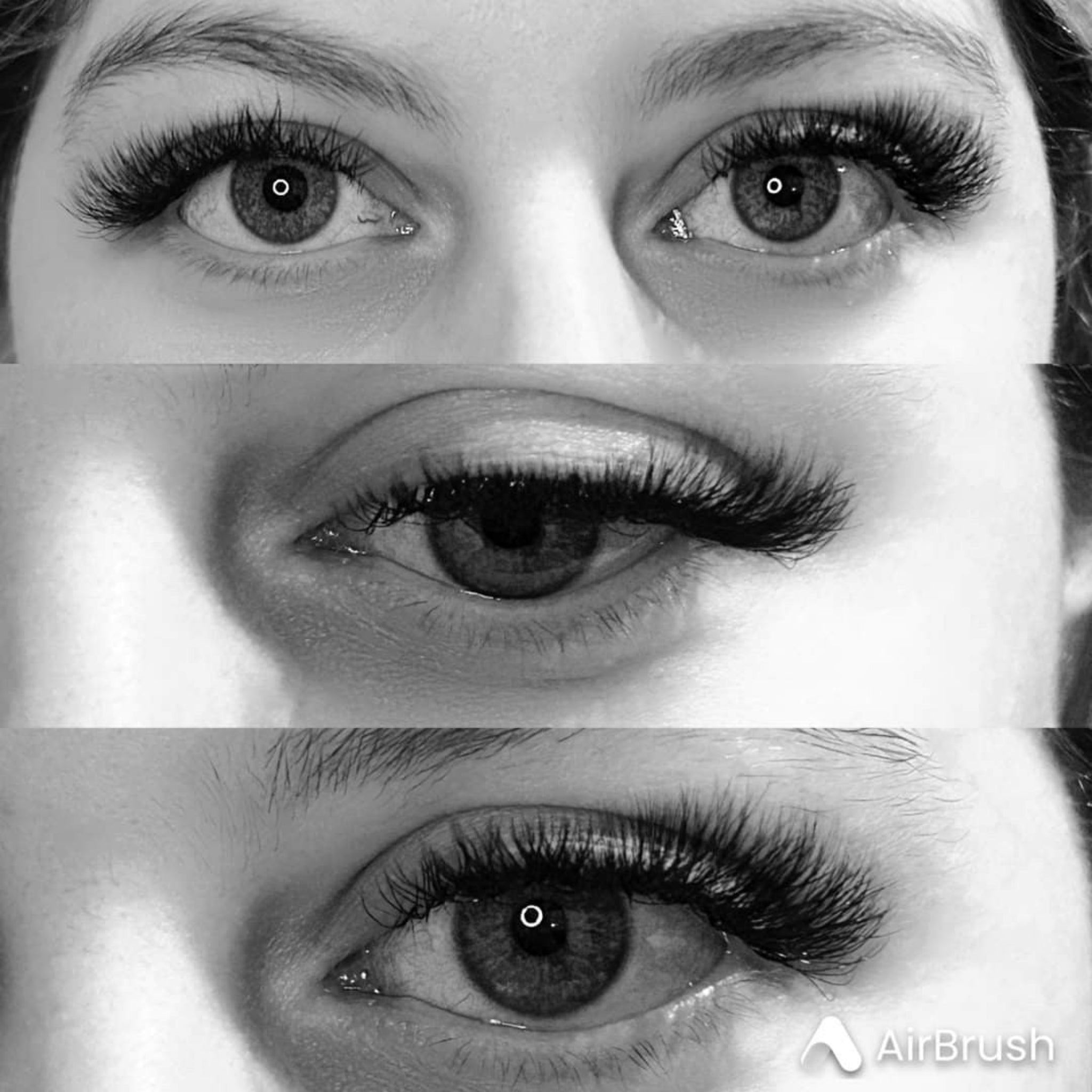 Ladybug Lashes 4D Clover Sample Tray model shot showing both eyes with natural-length 4D clover lash extensions applied, with green-hazel iris visible from a slightly overhead angle