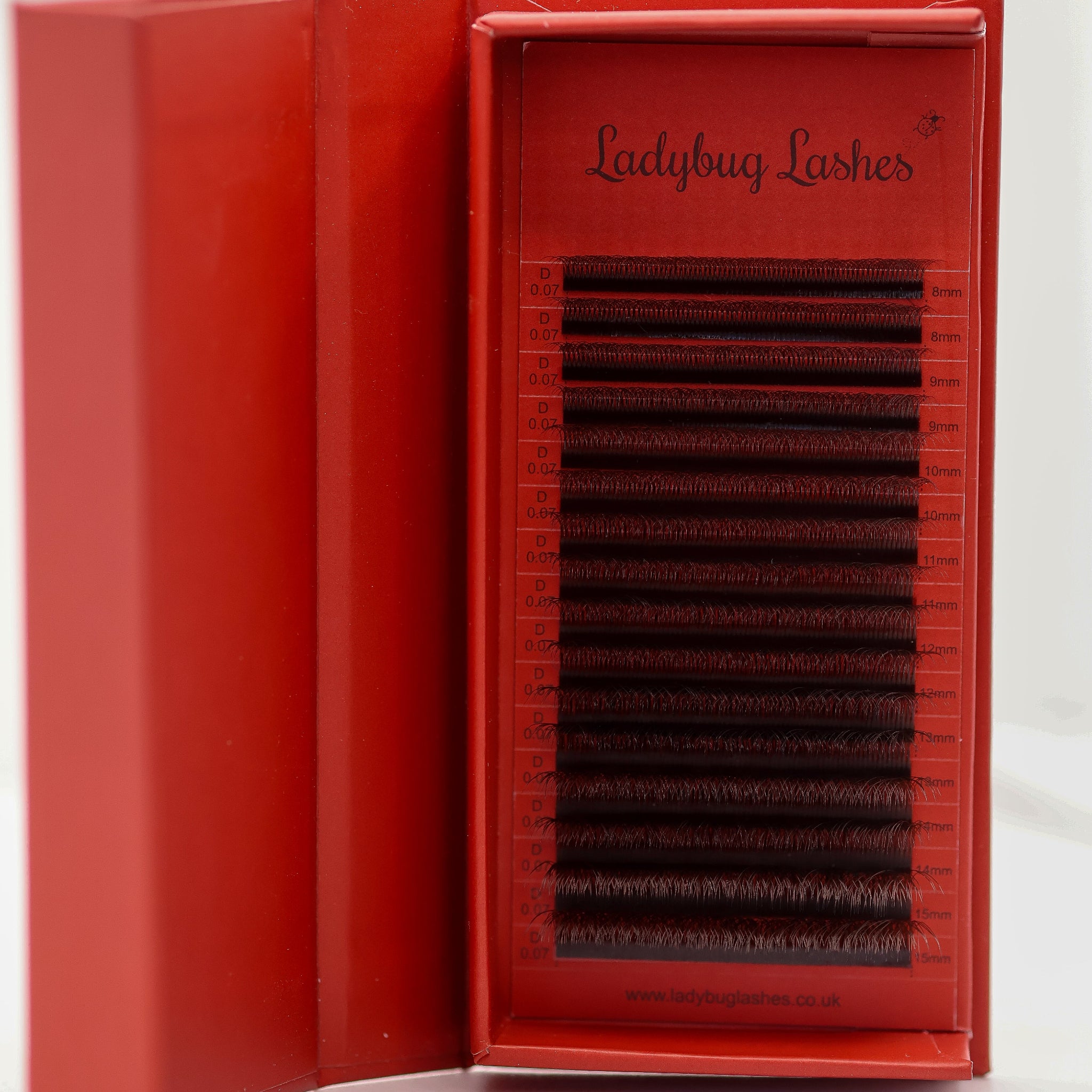 Ladybug Lashes 16-row brown 6D Clover tray showing full strip of pre-made volume fans from 8mm to 15mm in warm brown tone