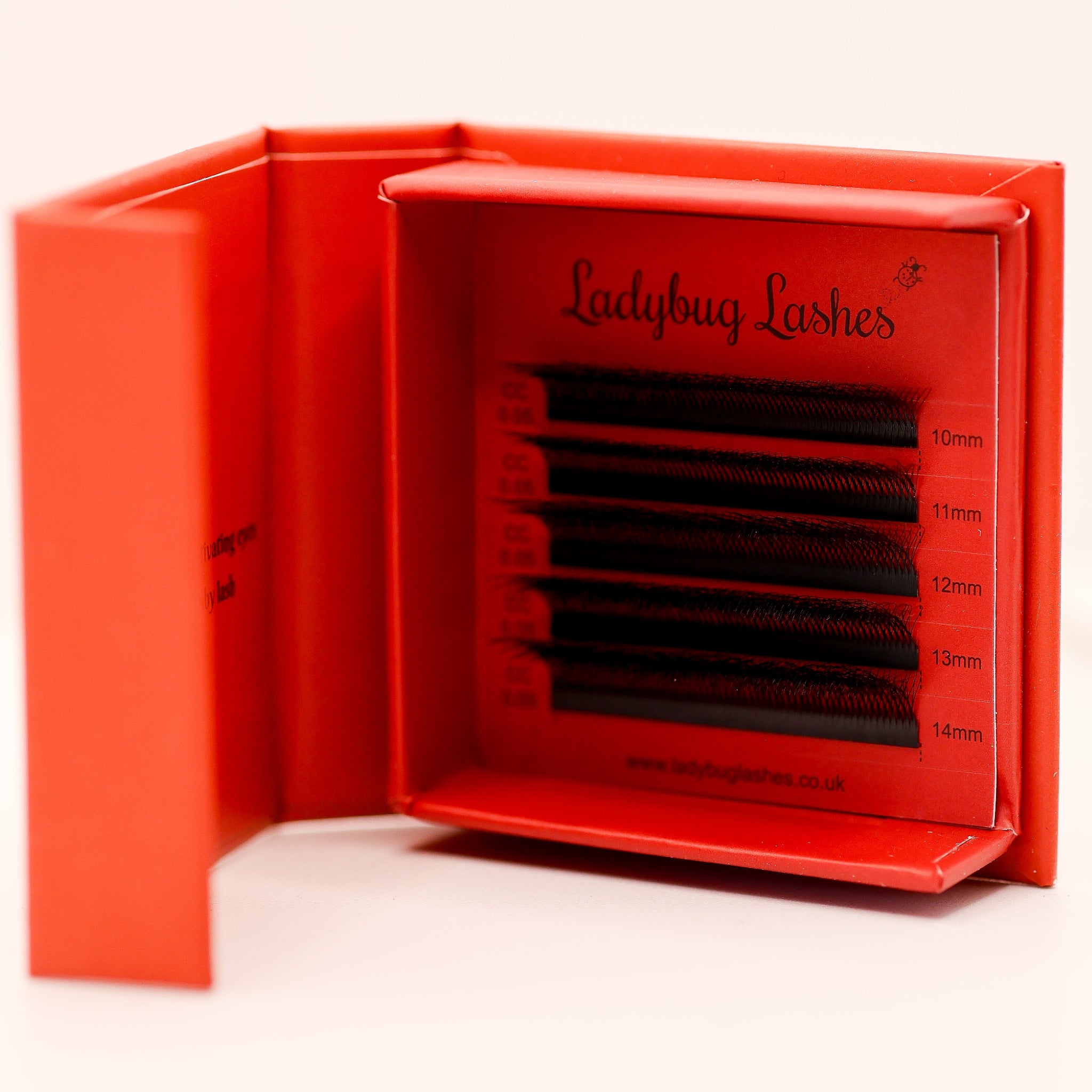 Ladybug Lashes Sample Tray 8D Clover open showing five rows of black CC curl fans in mixed lengths 10–14mm in red branded box from straight front view