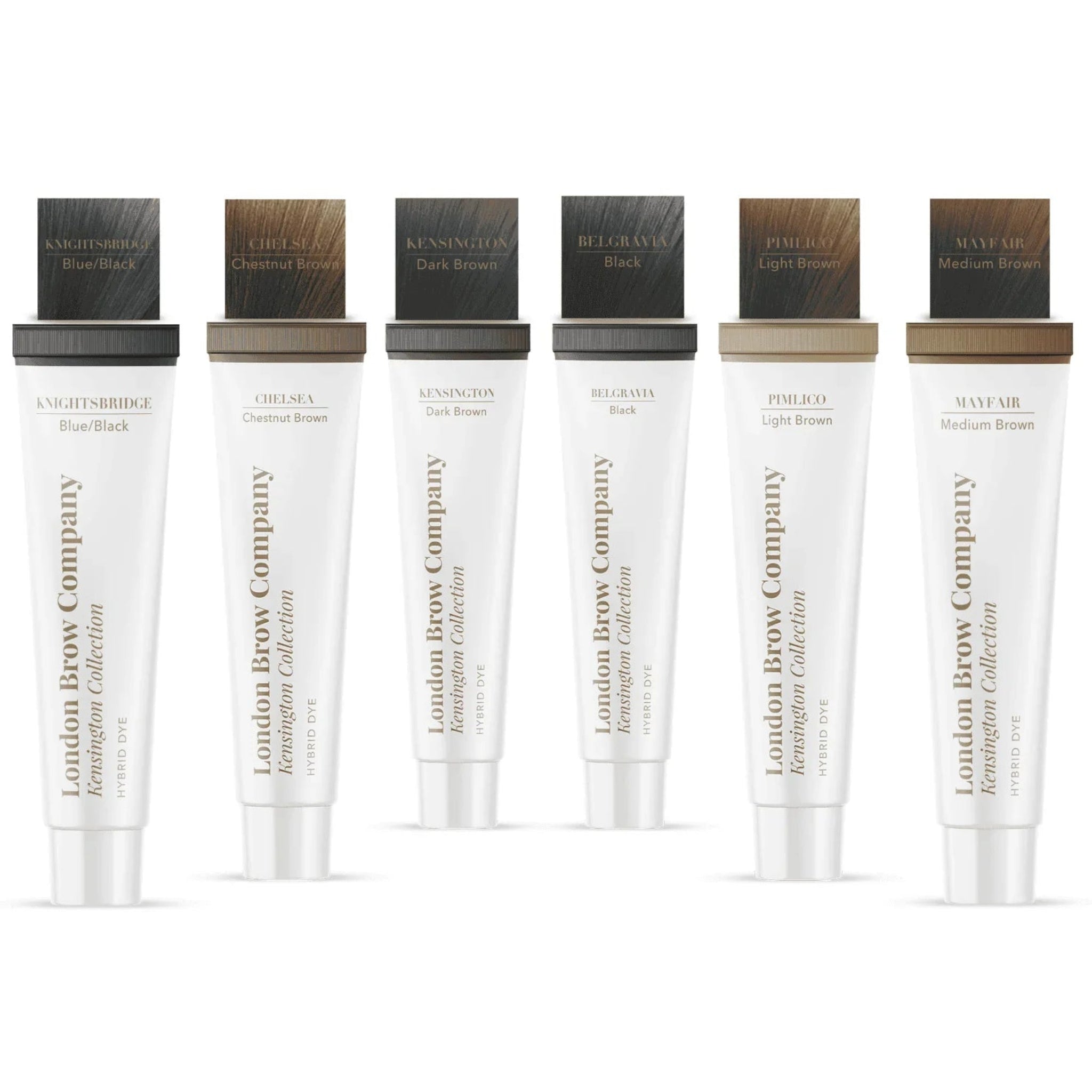 London Brow Company Kensington Collection Hybrid Dye six tubes product lineup showing colour swatches on cap tops — Knightsbridge Blue Black, Chelsea Chestnut Brown, Kensington Dark Brown, Belgravia Black, Pimlico Light Brown, Mayfair Medium Brown — from front angle on white background