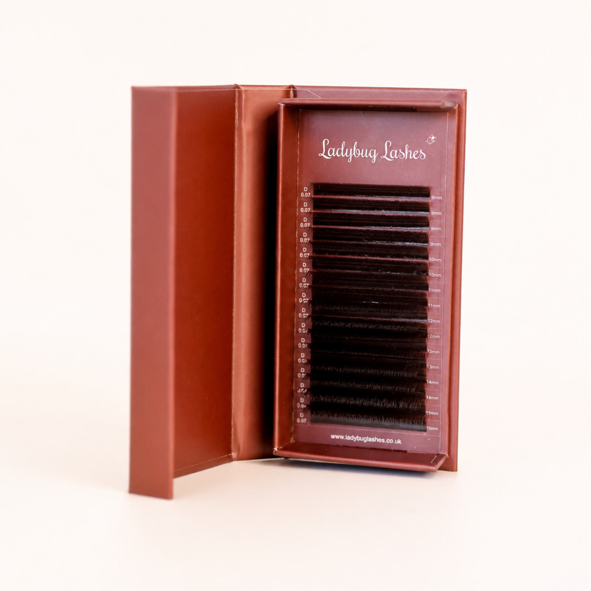 Ladybug Lashes Brown Fairy lash mixed tray in open burgundy box showing D curl 0.07 brown lash extensions from 8mm to 15mm angled side view