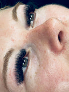 Close-up of a person's eye with long eyelashes