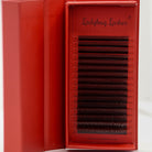 Ladybug Lashes 16-row brown 6D Clover tray showing full strip of pre-made volume fans from 8mm to 15mm in warm brown tone