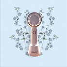 Handheld fan with floral design on a light blue background