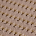 Close-up of Ladybug Lashes Platinum Brown Promade fans showing soft brown fibre tips and CC curl structure from side angle