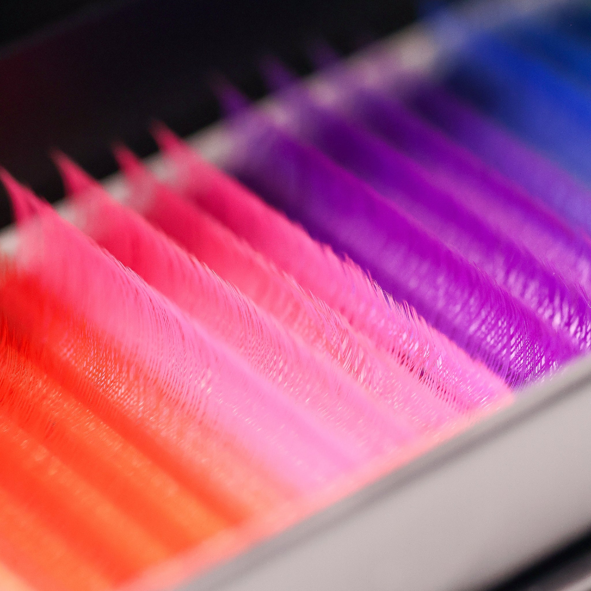 Close-up of Ladybug Lashes Tinsel lash rows showing iridescent shimmer fibres and skinny bases