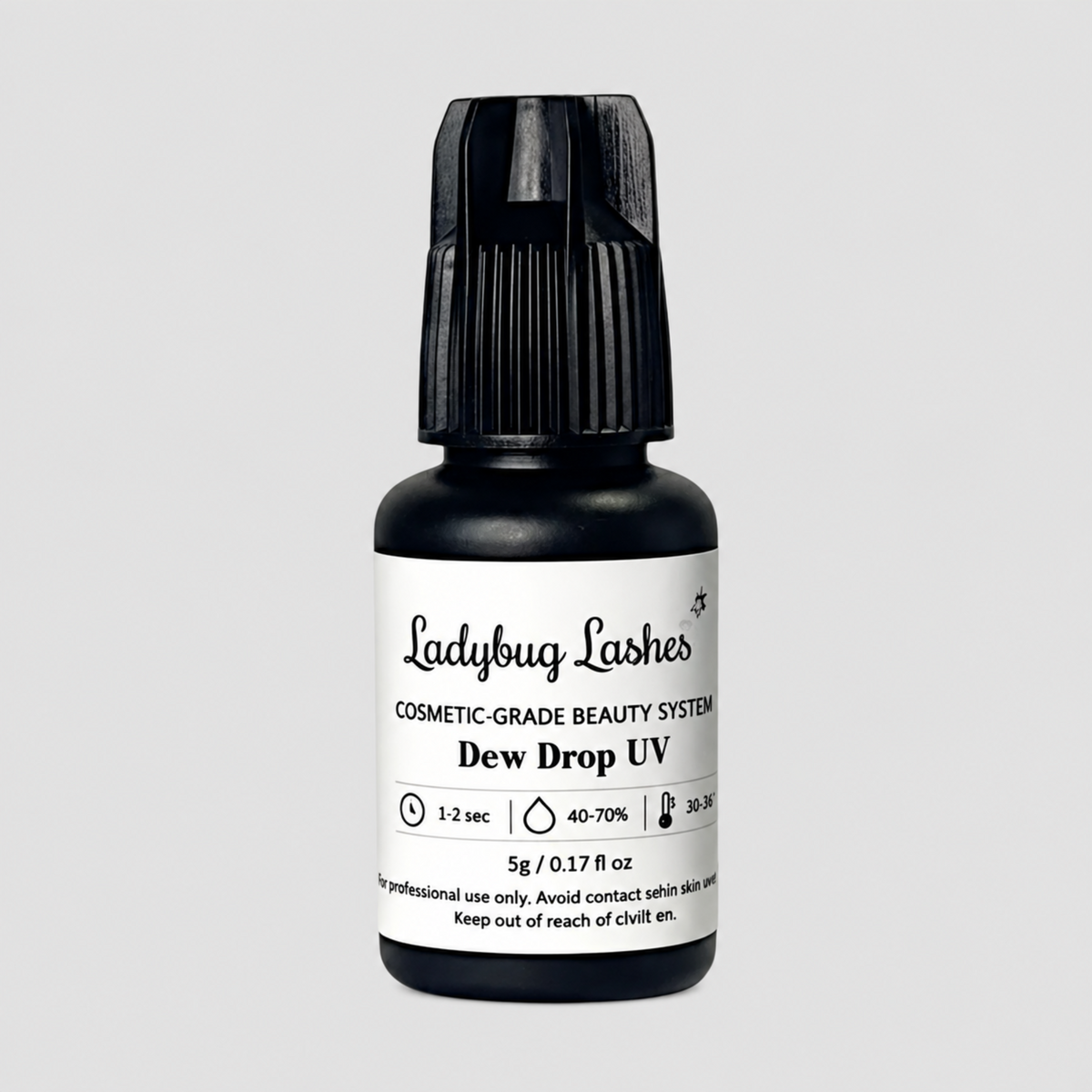 A bottle of Ladybug Lashes Dew Drop UV cosmetic-grade beauty system on a light gray background.
