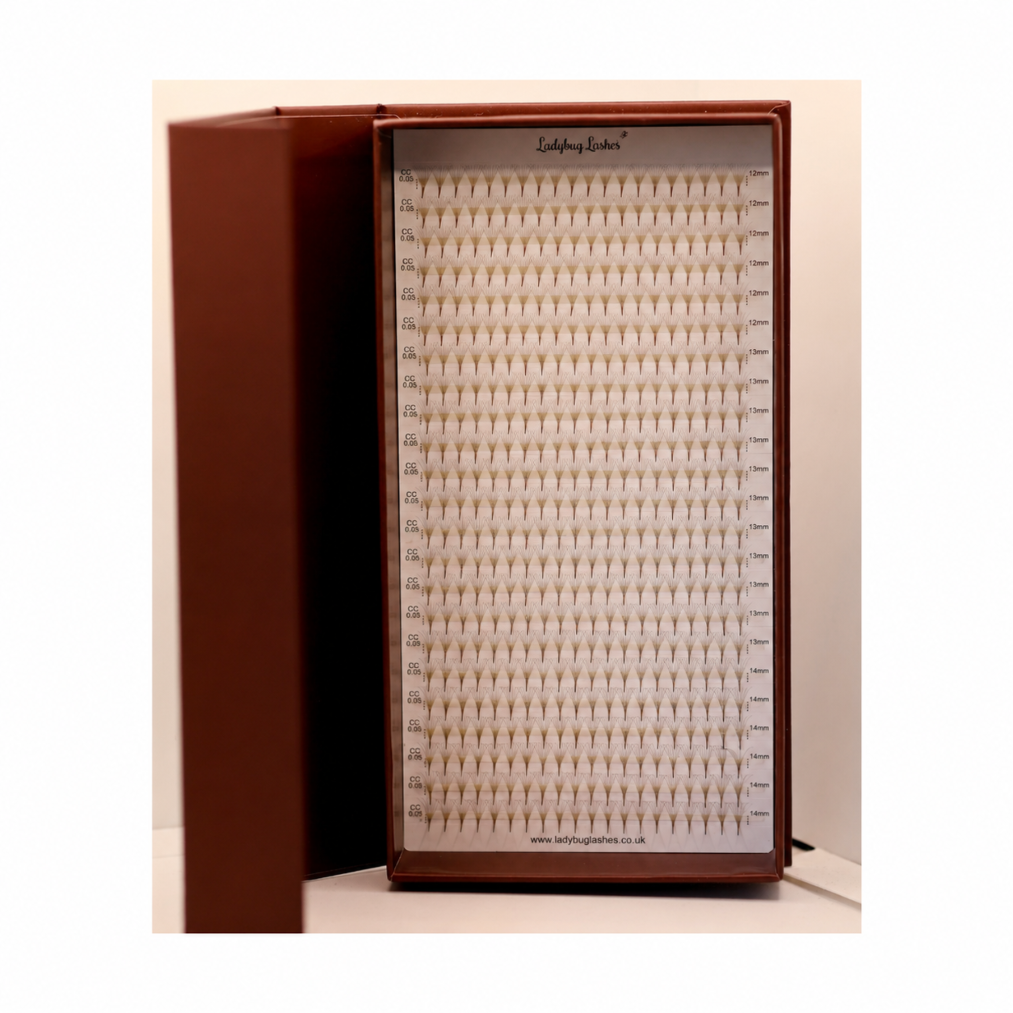 Ladybug Lashes Platinum Brown Promade Tray open showing 920 fans in warm brown fibres across both panels front view