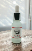 A bottle of 'Super bonder 10ml Strawberry Scented' with a dropper, labeled for eyelash extensions.
