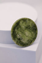 Green jade stone lash glue tile – close-up – LADYBUGLASHES