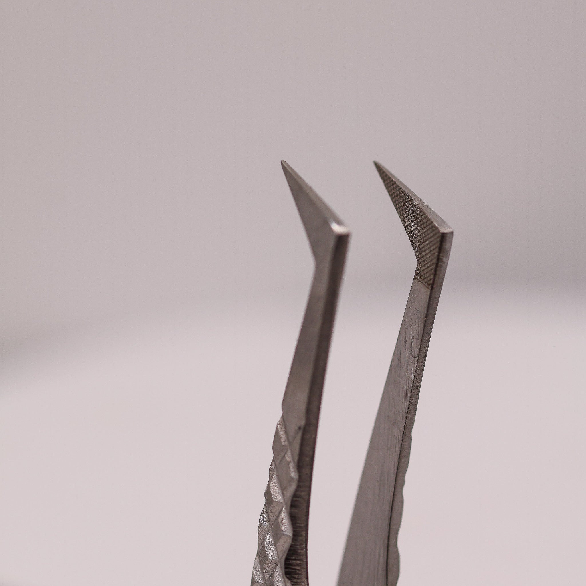 Close-up of LADYBUGLASHES Isolation Boot Tweezers – fibre grip tip detail