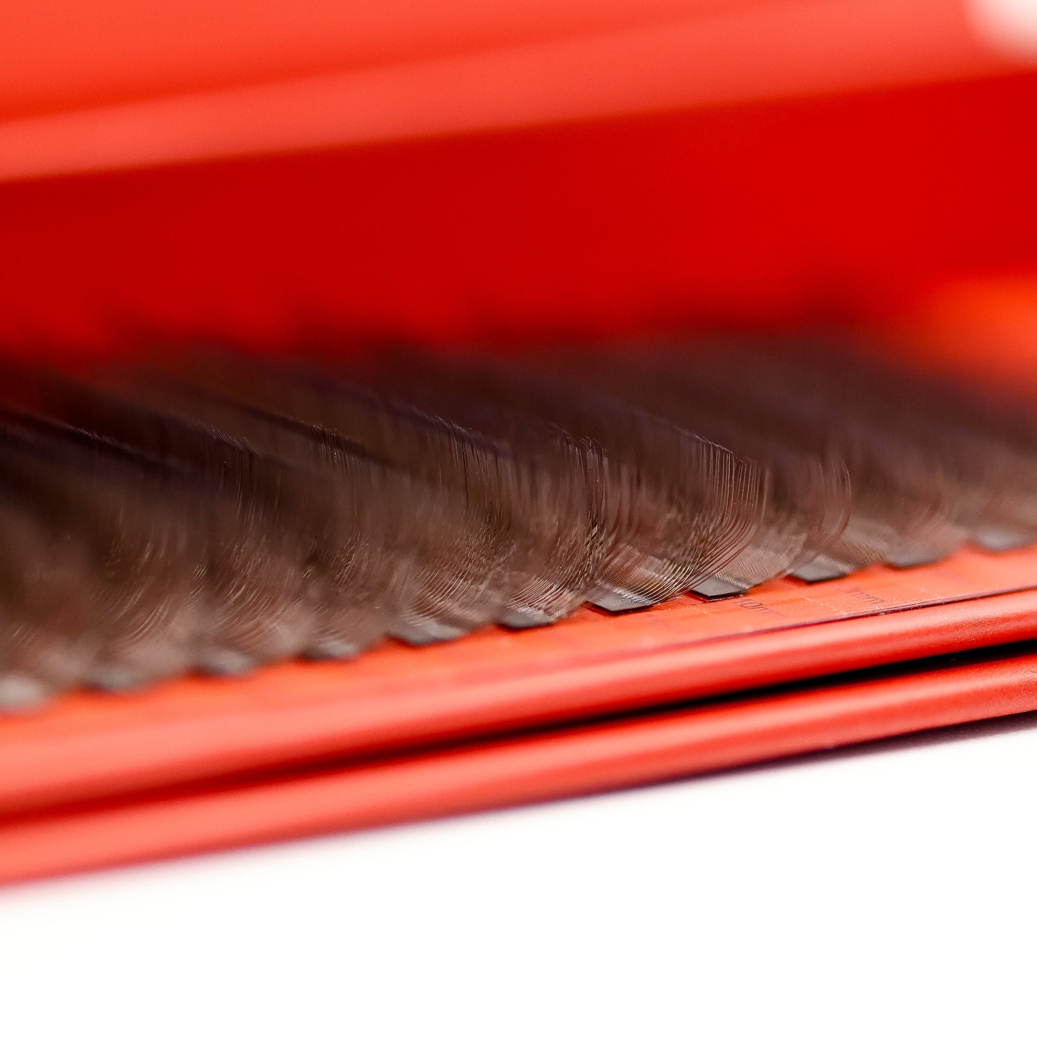 Close-up of Ladybug Lashes Brown 4D Clover fans showing warm brown curl definition and skinny bases from above