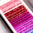 Close-up of Ladybug Lashes YY and Tinsel Lash Collection showing shimmering tinsel lash fibres and colour detail