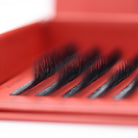 Close-up of Ladybug Lashes 6D Clover fan row showing dense black fibres and curl lift from low angle