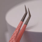 Close-up of LADYBUGLASHES Angled Volume Tweezers – pink fibre grip tip detail