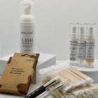Ladybug Lashes Flutter and Frame TGA System Brow Lamination Kit flatlay showing Ladybug Lashes Lash Shampoo 50ml foam pump, three Flutter and Frame TGA System airless pump bottles One Two and Three, bamboo interdental brushes pack, cotton buds and microfibre brushes on white background
