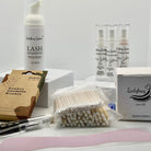 Ladybug Lashes Express Cysteamine Brow Lamination Kit flatlay showing Ladybug Lashes Lash Shampoo foam pump, three Flutter and Frame Express Cysteamine airless pump bottles One Two and Three, Ladybug Lashes 42mm x 200m brow lamination wrap box, bamboo interdental brushes pack, cotton buds, microfibre brushes and pink silicone spatula on white background
