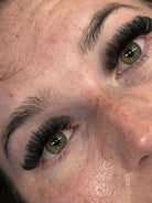 Close-up of a person's eyes with long eyelashes
