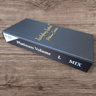 Black box labeled 'Platinum Volume L Mix' on a wooden surface