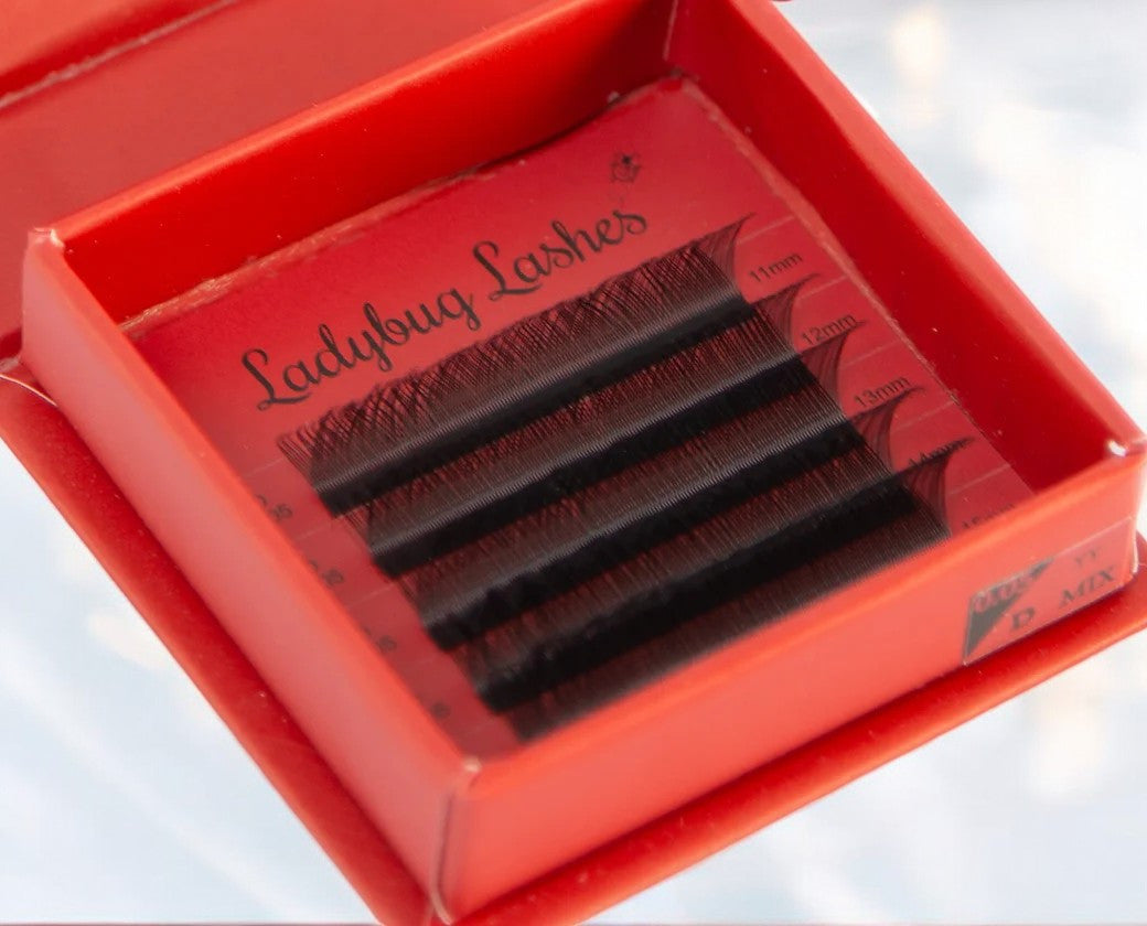 Close-up of a person's eyes wearing YY false eyelashes, showcasing the product's appearance and effect on the eyelash volume and shape.