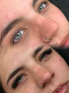 Close-up of two people with a split effect, showing their eyes and noses.
