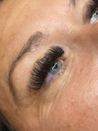 Close-up of an eye with a false eyelash applied