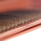 Macro close-up of brown W lash extensions on Ladybug Lashes tray showing 12mm length marking and distinctive W curl shape