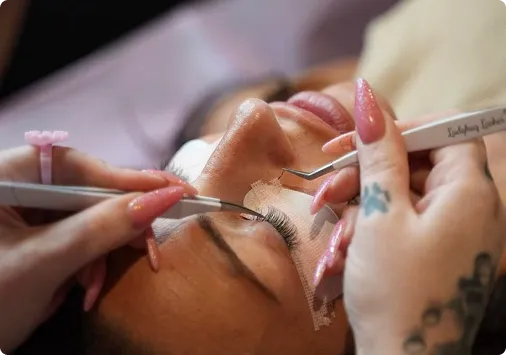 Professional lash technician applying lash extensions