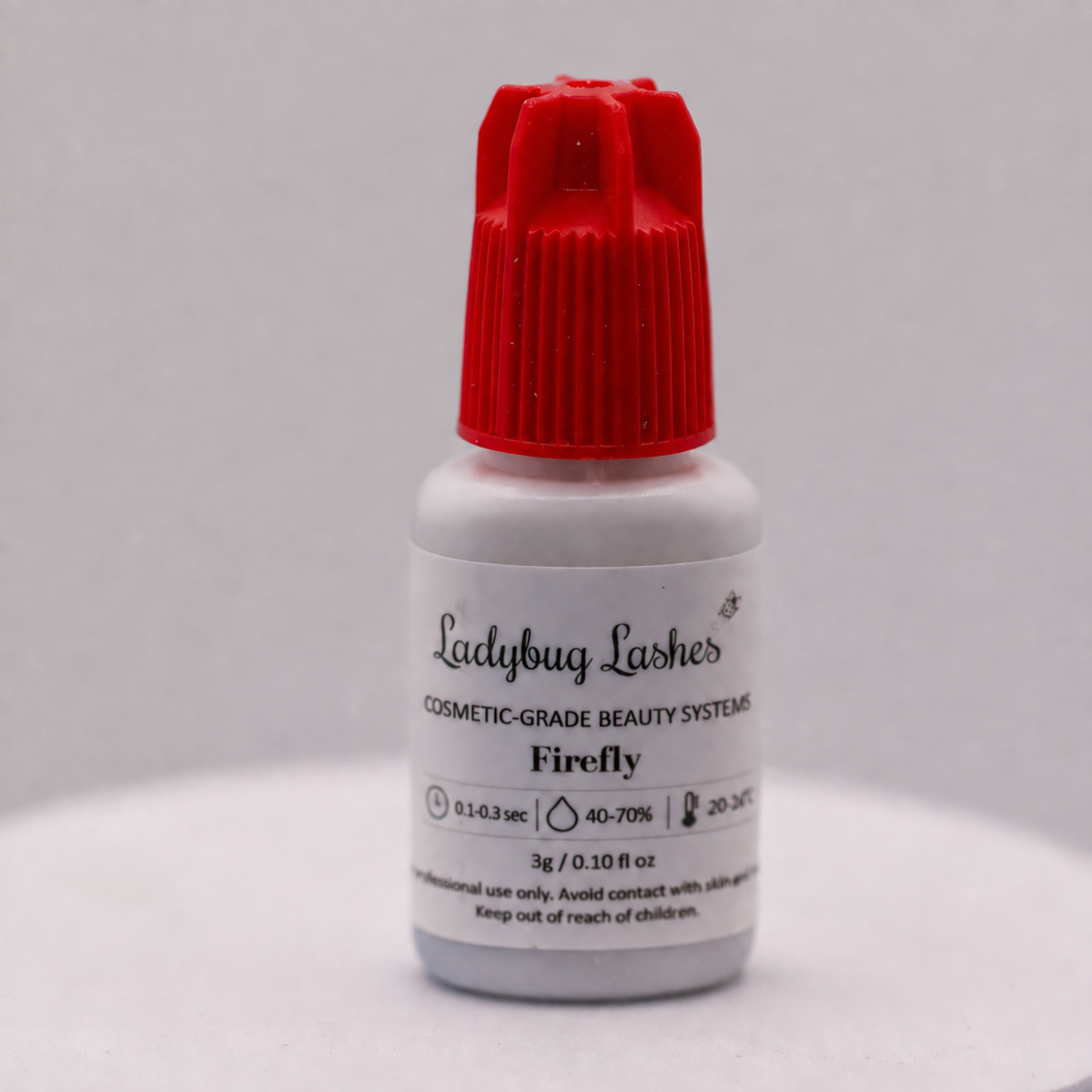 Ladybug Lashes Firefly Cosmetic Grade Lash Adhesive 3g bottle with red cap, 0.1-0.3 second bond time, for professional lash extension use