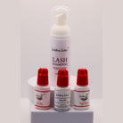 Ladybug Lashes Low Humidity Retention Trio showing four products on a white background: Lash Shampoo 50ml foam pump bottle, Booster 10ml bottle with red cap, Meadow adhesive 1g bottle with red cap, and SuperBonder 10ml bottle with red cap
