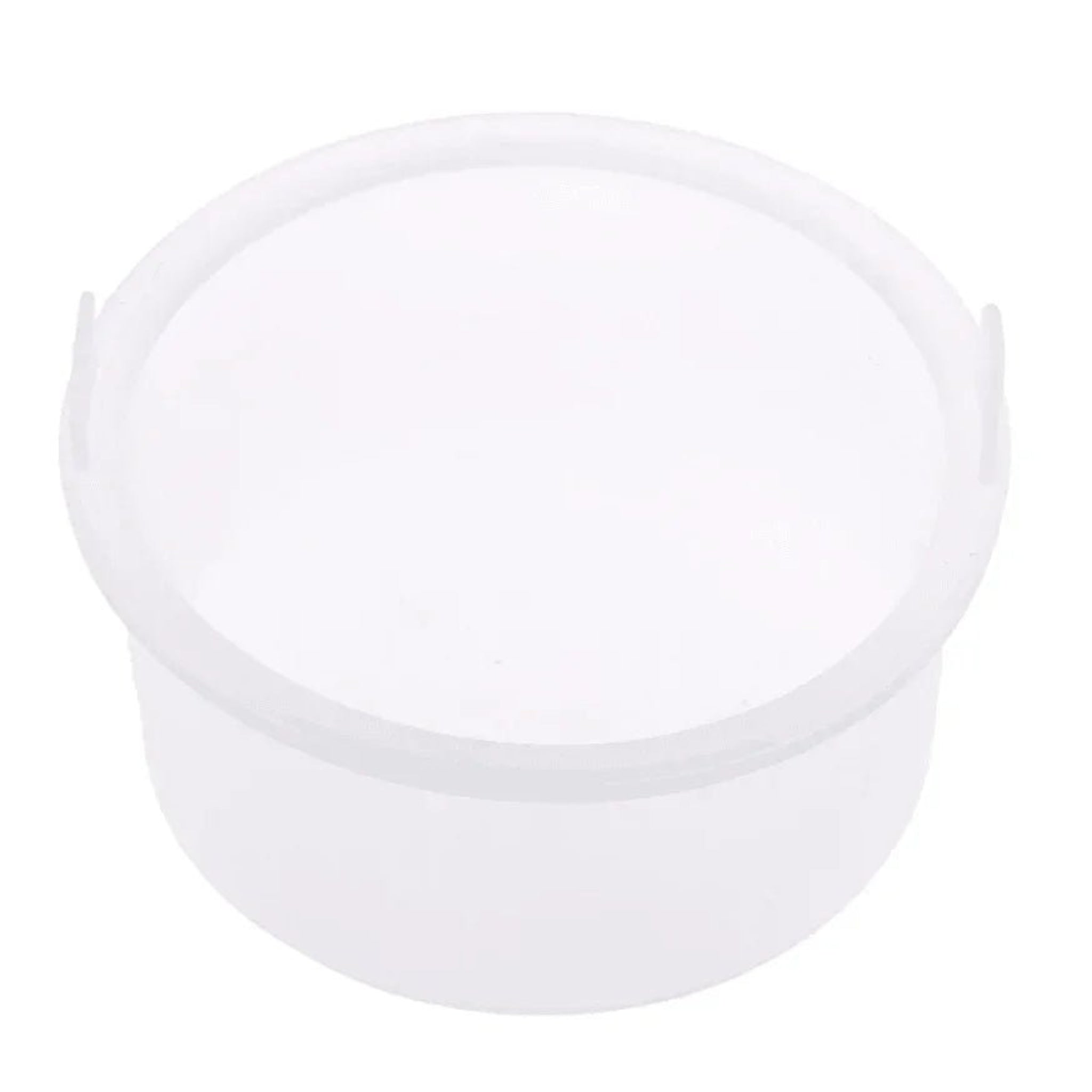 London Brow Company Silicone Wax Pot Liner product shot showing empty translucent white silicone removable round wax pot insert with two side grip tabs from diagonal overhead angle on white background