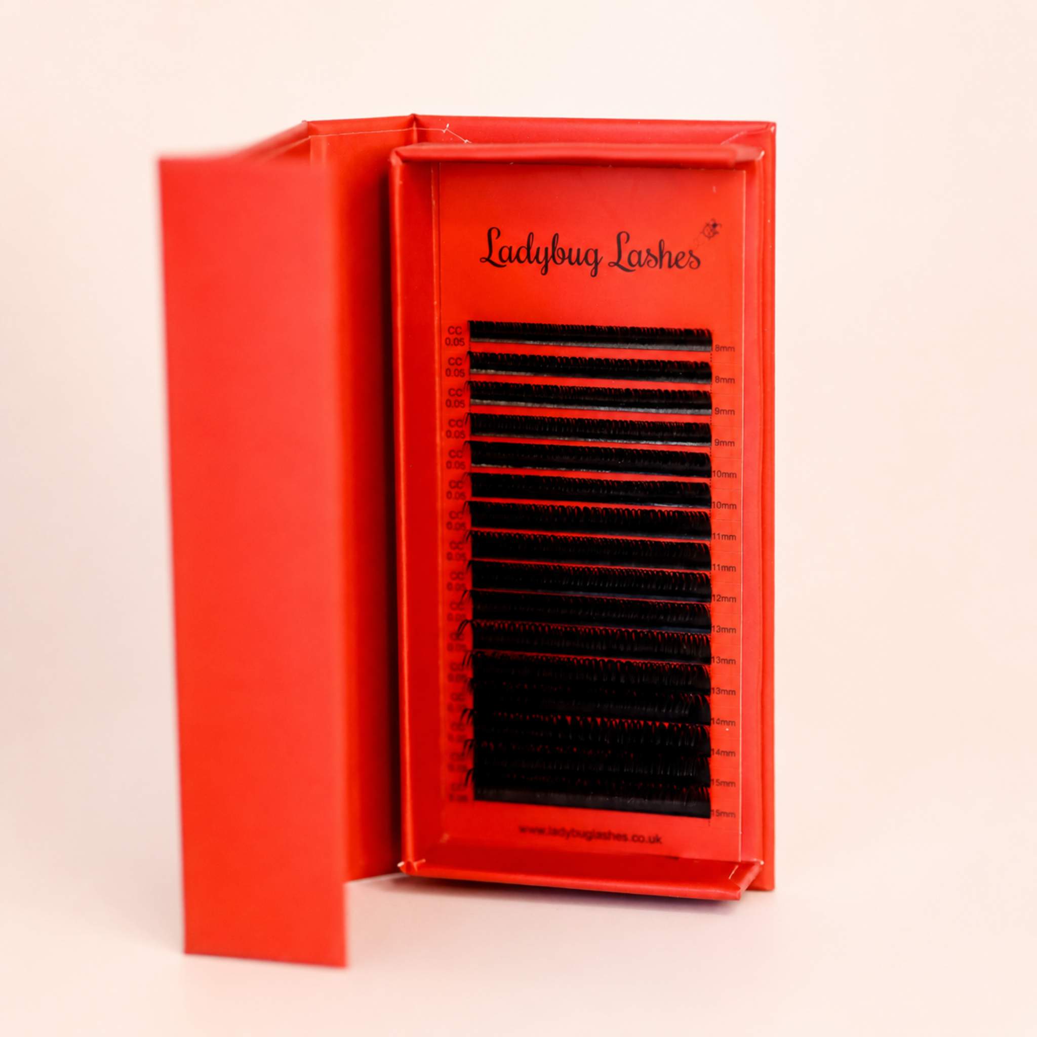 Ladybug Lashes Wet Look lash mixed tray open in branded box showing 16 rows of glossy black wet look lash extensions from 8mm to 15mm front view